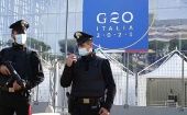 Policías italianos resguardan el centro de convenciones donde se celebrará la cumbre del G20 en Roma.