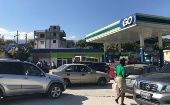 Citizens queue in their cars to buy gasoline, Haiti, 2021.