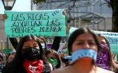 The banner reads: "Rich women abort, poor women die," Quito, Ecuador, Feb. 17, 2022.
