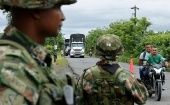 Paramilitaries control road traffic, Colombia. 