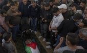 People accompanies a Palestinian man killed by the Israeli occupation forces, 2022.