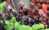 Peruvian police block the passage of Venezuelan soccer players, Nov. 22, 2023.