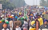 Farmers march along a highway in India, Feb. 18, 2024.