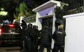 Ecuadorian Police entering to the Mexican Embassy in Quito.