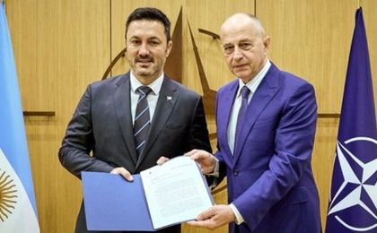 Defense Minister Luis Petri (L) & NATO Deputy Secretary Mircea Geoana (R).