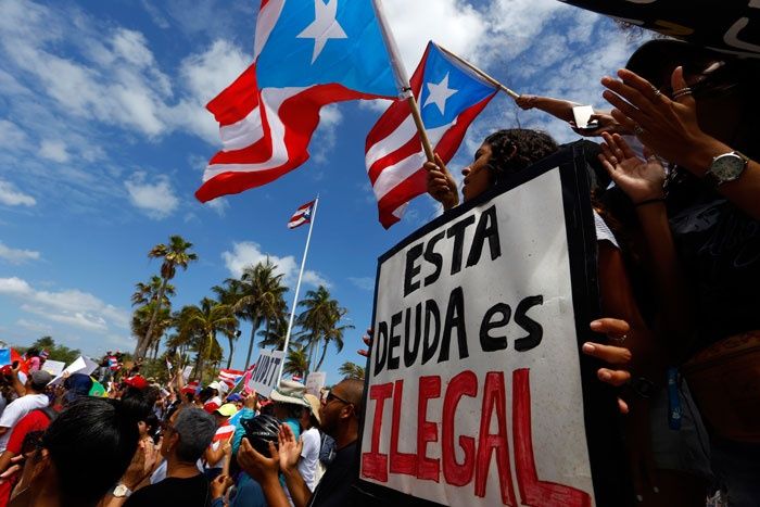 Puertorriqueños exigen que se audite la deuda en la isla. Foto: EFE