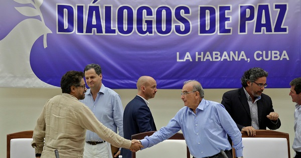 Lead negotiators Humberto de la Calle and FARC's Ivan Marquez shake hands after signing the protocol and timetable for the disarmament of the FARC  in Havana COLOMBIA-PEACE/TALKS Colombia's lead government negotiator Humberto de la Calle and Colombia's FARC lead negotiator Ivan Marquez after signing the protocol in Havana