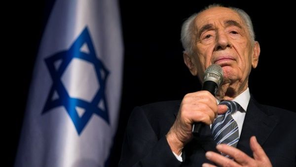 Israel's President Shimon Peres speaks to the media during a news conference in the southern town of Sderot July 6, 2014.