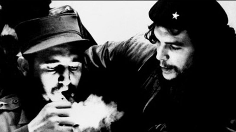 This file photo taken in the 1960s shows then Cuban Prime Minister Fidel Castro (L) lighting a cigar while listens Argentine Ernesto Che Guevara.