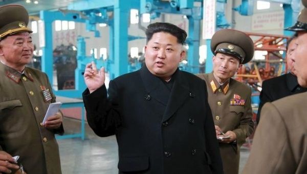 North Korean leader Kim Jong Un gave field guidance to the machine plant managed by Jon Tong Ryol in this undated photo released by North Korea's Korean Central News Agency (KCNA) in Pyongyang April 1, 2015.