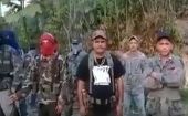 Edgar Montenegro, alias "El Comandante Cabezón", ex contra de los 80´, primero de la derecha y "El Comandante Nicaragua", Marvin Figueroa, con camiseta negra sin capucha.