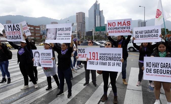Demonstrators protest over the killing of former FARC combatant Astrid Conde in Bogota, Colombia, on June 16, 2020.