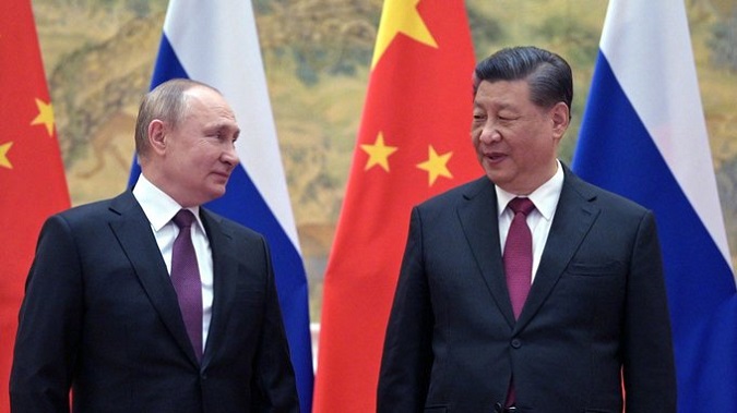 Russian President Vladimir Putin and Chinese President Xi Jinping pose for a photograph during their meeting & the recent anti-NATO joint statement in Beijing, on February 4, 2022