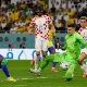 Croatia goalkeeper Dominik Livakovic saves a Brazilian shot, Dec. 9, 2022.