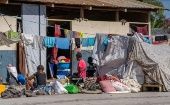 El avance de los antisociales provoca que los haitianos abandonen sus hogares en la capital.